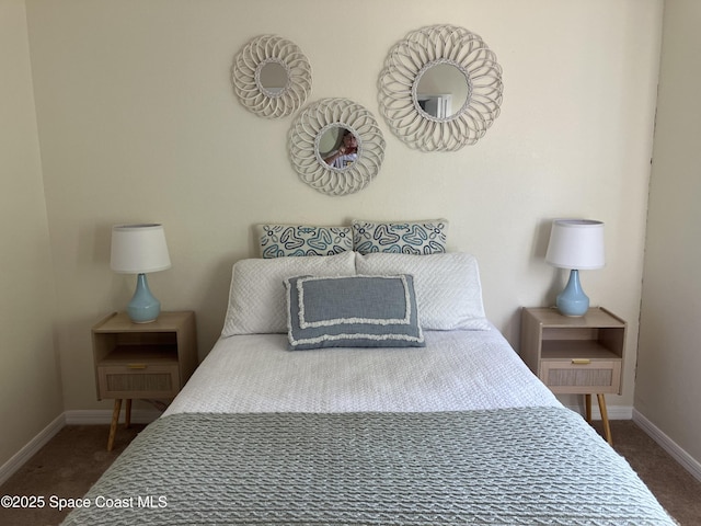 bedroom with carpet and baseboards