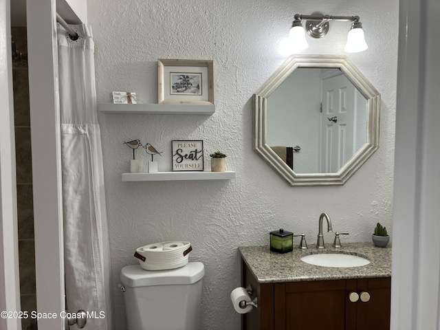 full bath with a shower with shower curtain, toilet, and vanity