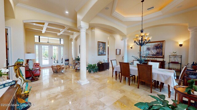 5454 Riveredge Dr, Titusville, FL 32780 - dining room with decorative columns, arched walkways, coffered ceiling, a chandelier, and ornamental molding