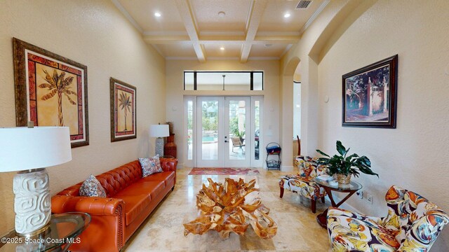 5454 Riveredge Dr, Titusville, FL 32780 - living area with beam ceiling, coffered ceiling, french doors, recessed lighting, and a textured wall