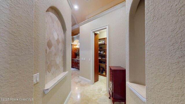 5454 Riveredge Dr, Titusville, FL 32780 - hall with a textured wall and arched walkways