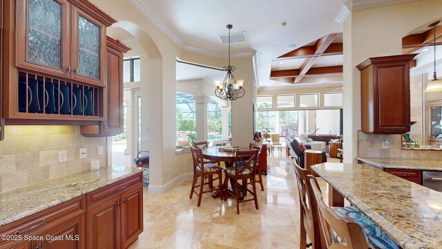 5454 Riveredge Dr, Titusville, FL 32780 - dining room featuring coffered ceiling, crown molding, beamed ceiling, a chandelier, and baseboards