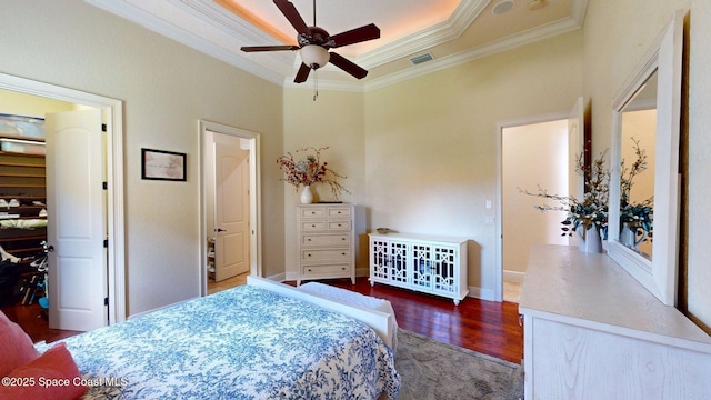5454 Riveredge Dr, Titusville, FL 32780 - bedroom featuring wood finished floors, crown molding, a raised ceiling, and baseboards