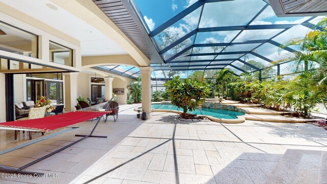 5454 Riveredge Dr, Titusville, FL 32780 - view of pool with a patio area, glass enclosure, and a pool with connected hot tub