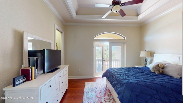 5454 Riveredge Dr, Titusville, FL 32780 - bedroom featuring access to outside, dark wood finished floors, ornamental molding, a tray ceiling, and a ceiling fan