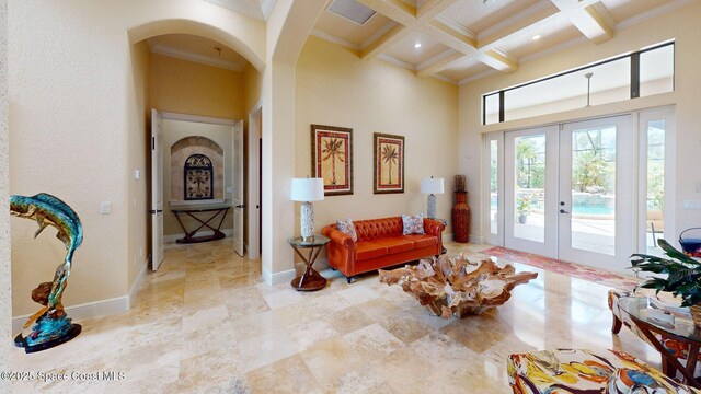 5454 Riveredge Dr, Titusville, FL 32780 - living area with beamed ceiling, arched walkways, crown molding, coffered ceiling, and a high ceiling