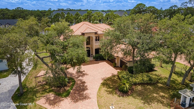 5454 Riveredge Dr, Titusville, FL 32780 - view of front of property with a tiled roof, stucco siding, and decorative driveway