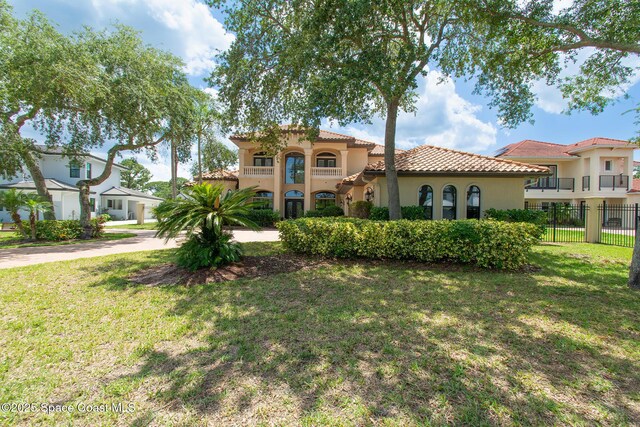 5454 Riveredge Dr, Titusville, FL 32780 - mediterranean / spanish-style house featuring a tile roof and stucco siding