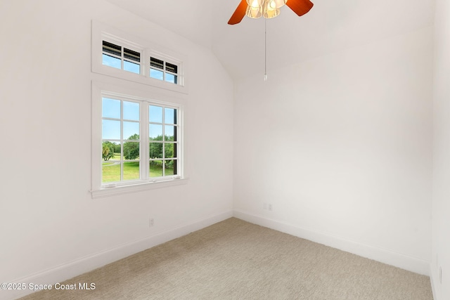7021 S Tropical Trl, Merritt Island, FL 32952 - carpeted empty room with baseboards, a ceiling fan, and lofted ceiling