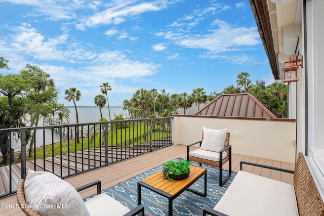 7021 S Tropical Trl, Merritt Island, FL 32952 - wooden terrace with a water view