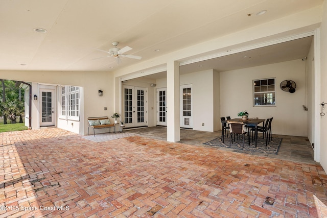 7021 S Tropical Trl, Merritt Island, FL 32952 - view of patio / terrace with french doors, ceiling fan, and outdoor dining area