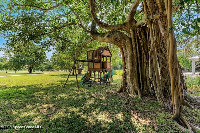 7021 S Tropical Trl, Merritt Island, FL 32952 - view of playground with a yard