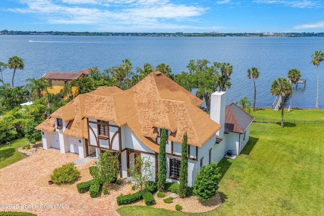 7021 S Tropical Trl, Merritt Island, FL 32952 - aerial view of property and surrounding area with a large body of water
