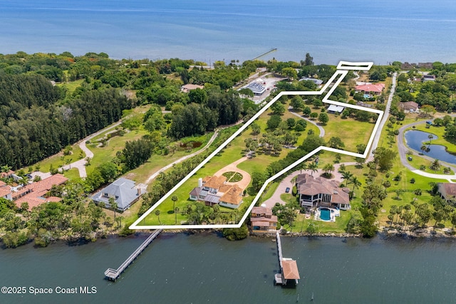 7021 S Tropical Trl, Merritt Island, FL 32952 - aerial view of property and surrounding area with a nearby body of water and property parcel outlined