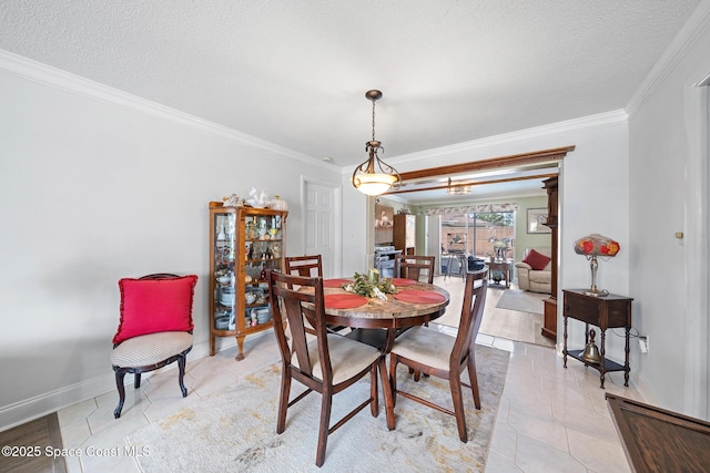 445 Park Ave, Satellite Beach, FL 32937 - dining area with ornamental molding, light tile patterned floors, and a textured ceiling