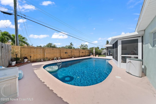 445 Park Ave, Satellite Beach, FL 32937 - view of pool with a fenced backyard and a sunroom