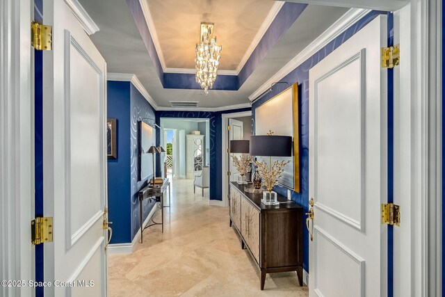 601 N Swim Club Dr Pha, Pha, Indian River Shores, FL 32963 - hallway featuring visible vents, crown molding, a notable chandelier, and a raised ceiling