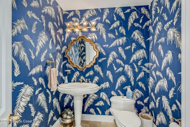 601 N Swim Club Dr Pha, Pha, Indian River Shores, FL 32963 - half bath featuring toilet, tile patterned flooring, baseboards, and wallpapered walls