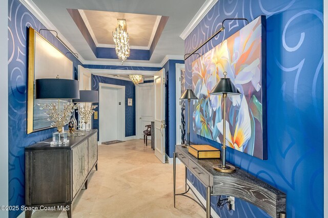 601 N Swim Club Dr Pha, Pha, Indian River Shores, FL 32963 - corridor featuring a tray ceiling, crown molding, and a chandelier