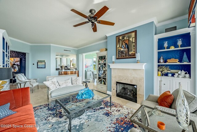 601 N Swim Club Dr Pha, Pha, Indian River Shores, FL 32963 - living area featuring a ceiling fan, crown molding, baseboards, and a fireplace