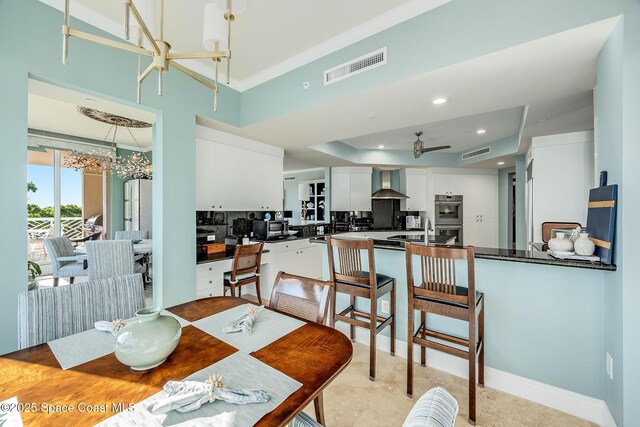 601 N Swim Club Dr Pha, Pha, Indian River Shores, FL 32963 - dining room with ceiling fan with notable chandelier, visible vents, recessed lighting, and a raised ceiling