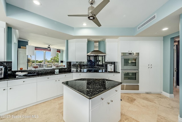 601 N Swim Club Dr Pha, Pha, Indian River Shores, FL 32963 - kitchen with a warming drawer, double oven, backsplash, visible vents, and wall chimney range hood