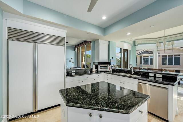 601 N Swim Club Dr Pha, Pha, Indian River Shores, FL 32963 - kitchen with white cabinetry, built in refrigerator, a sink, dishwasher, and a peninsula