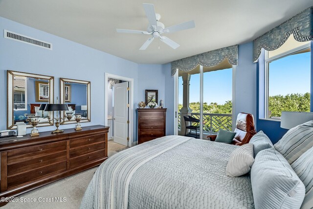 601 N Swim Club Dr Pha, Pha, Indian River Shores, FL 32963 - bedroom with connected bathroom, visible vents, a ceiling fan, and light colored carpet