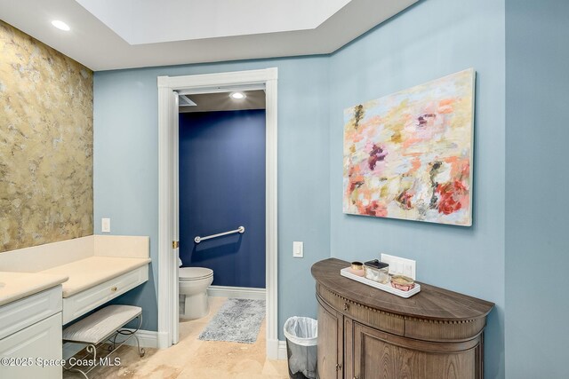 601 N Swim Club Dr Pha, Pha, Indian River Shores, FL 32963 - bathroom featuring baseboards, toilet, and vanity