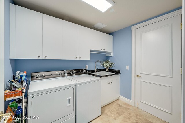 601 N Swim Club Dr Pha, Pha, Indian River Shores, FL 32963 - laundry room featuring cabinet space, a sink, and washer and clothes dryer