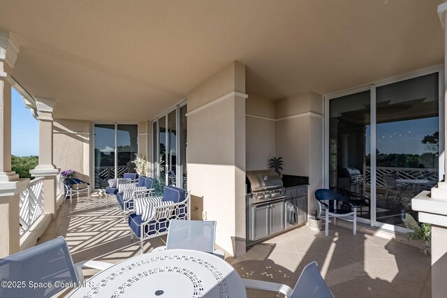 601 N Swim Club Dr Pha, Pha, Indian River Shores, FL 32963 - view of patio / terrace featuring exterior kitchen, outdoor dining space, and area for grilling