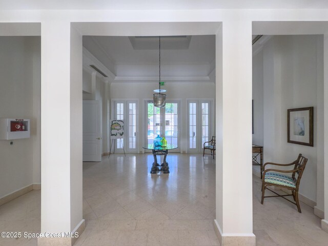 601 N Swim Club Dr Pha, Pha, Indian River Shores, FL 32963 - corridor featuring a tray ceiling, baseboards, french doors, and light tile patterned floors