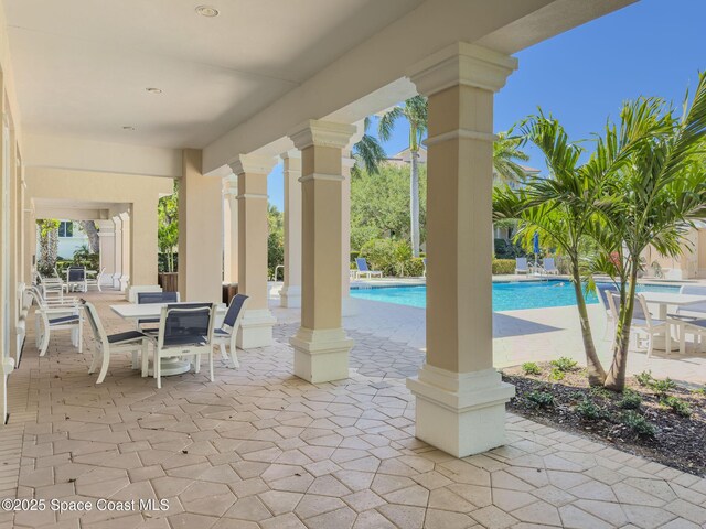601 N Swim Club Dr Pha, Pha, Indian River Shores, FL 32963 - view of patio / terrace featuring outdoor dining area and an outdoor pool
