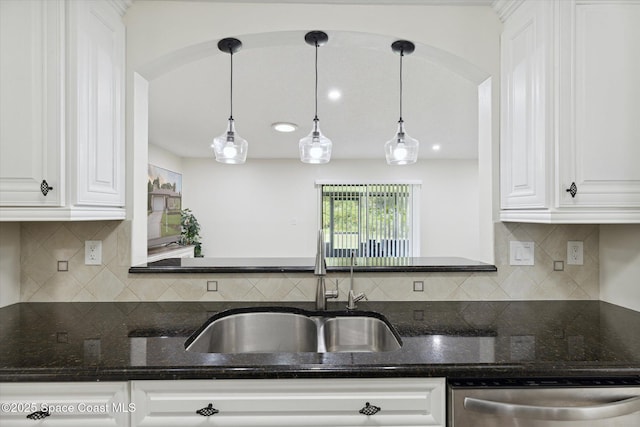 kitchen featuring white cabinets, a sink, and dishwasher