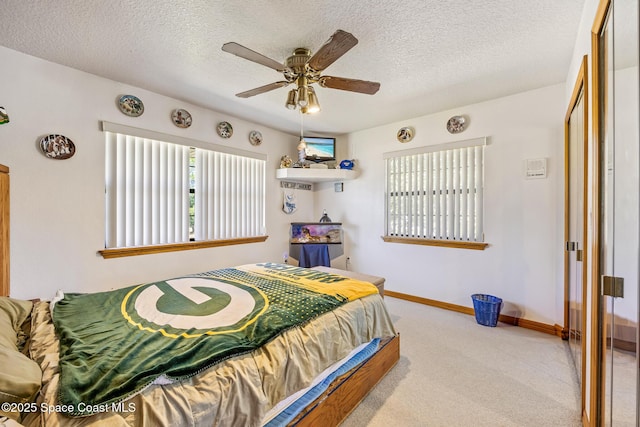 5425 James Ln, Mims, FL 32754 - bedroom featuring baseboards, ceiling fan, carpet, and a textured ceiling