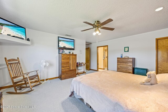 5425 James Ln, Mims, FL 32754 - bedroom with baseboards, carpet flooring, a textured ceiling, and visible vents
