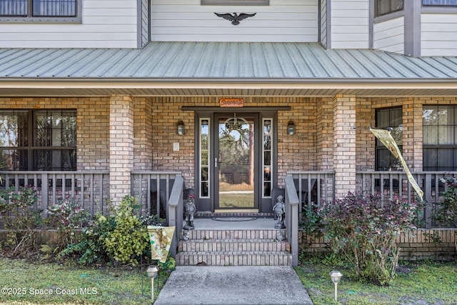 5425 James Ln, Mims, FL 32754 - property entrance with brick siding and a porch
