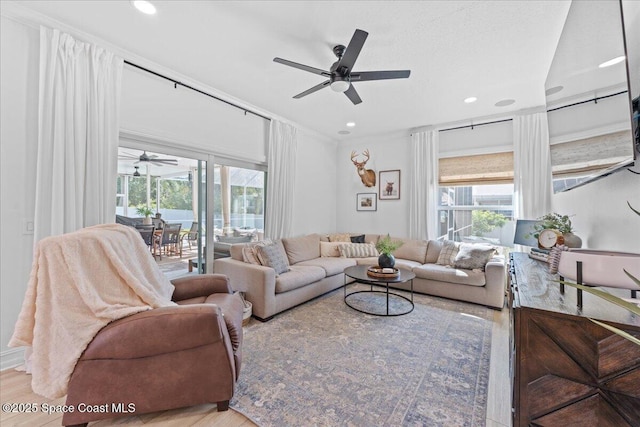 living room with wood finished floors, recessed lighting, and ceiling fan