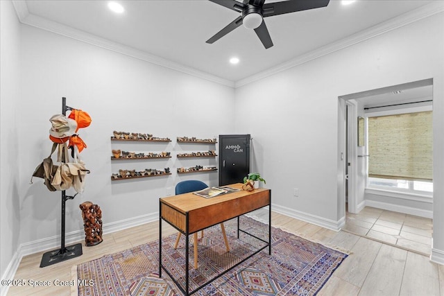 home office with crown molding, baseboards, light wood-style flooring, and a ceiling fan