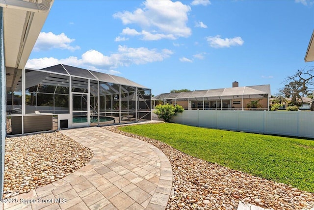 view of yard featuring a patio, a fenced backyard, a lanai, and an outdoor pool
