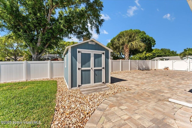 view of shed with a fenced backyard