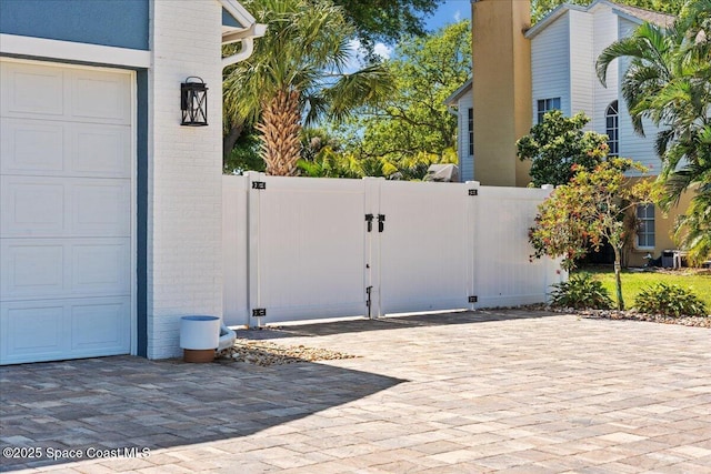 view of gate featuring fence