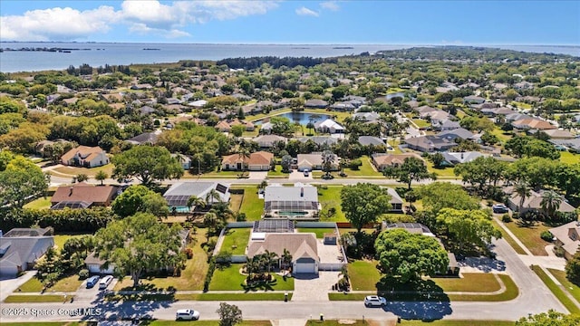aerial view featuring a residential view and a water view