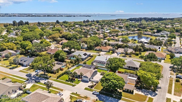 birds eye view of property featuring a residential view and a water view