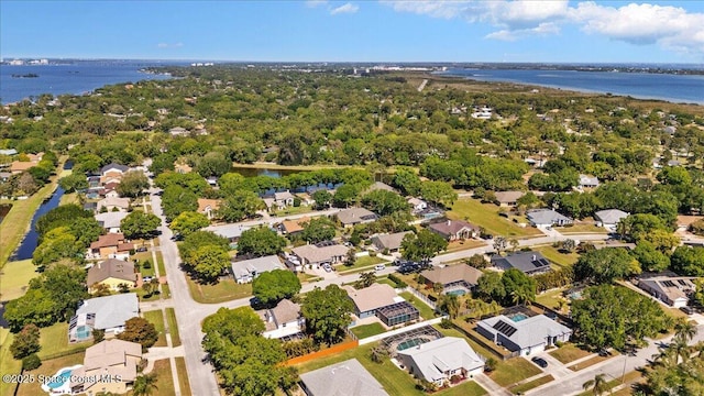 drone / aerial view with a residential view and a water view