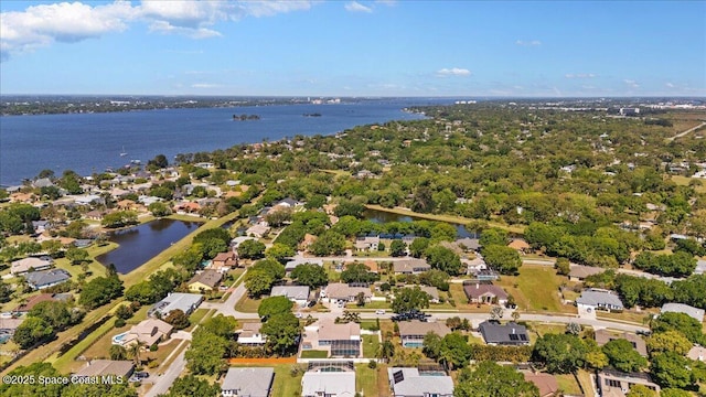 drone / aerial view featuring a water view and a residential view