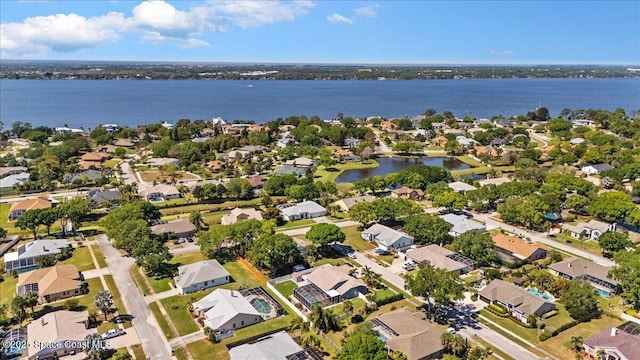 bird's eye view featuring a water view and a residential view