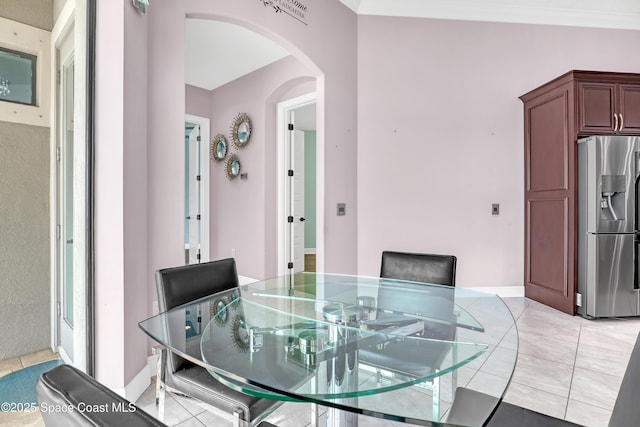 dining space with arched walkways