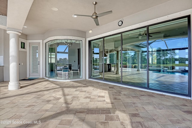 exterior space with ceiling fan and a patio