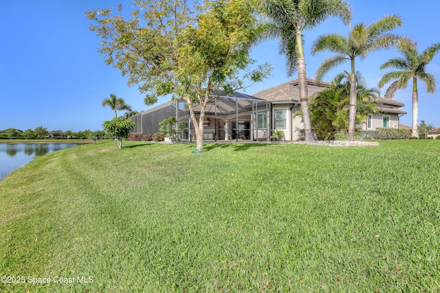 exterior space with a water view and a lanai